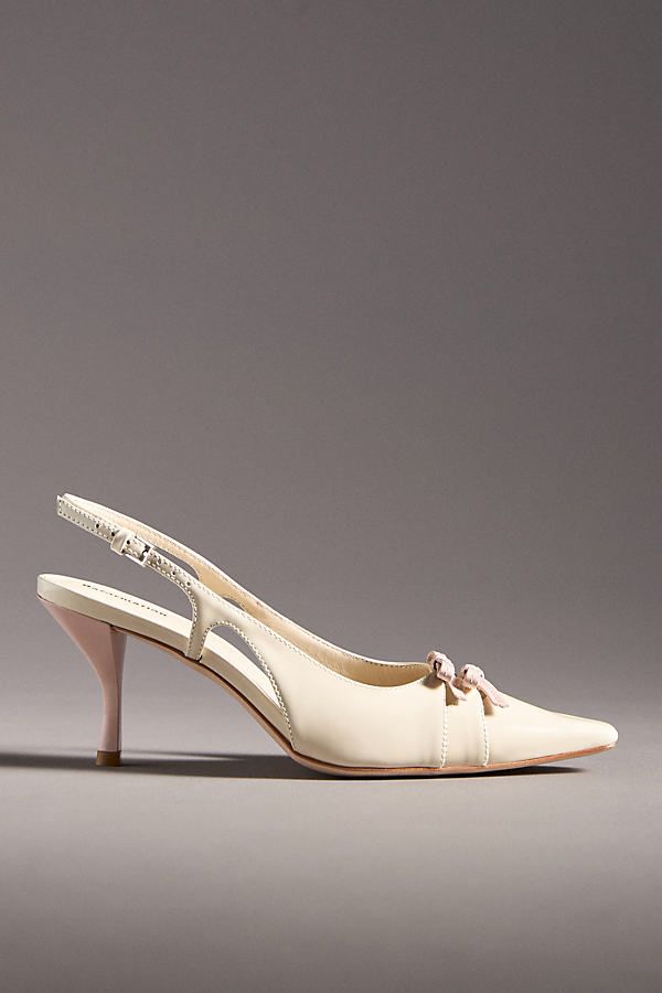 The Reformation Noreen Slingback Heels exude vintage charm with their elegant slingback design, pointed toe, and delicate bow details. | Noreen Slingback Heels by Reformation in White, Women's, Size: 5.5, Leather/Rubber at Anthropologie Grad Outfits, The Reformation, Slingback Heels, Shoes Heels Wedges, Slingback Heel, Heels & Wedges, Shoe Closet, Vintage Inspired Design, Pump Shoes