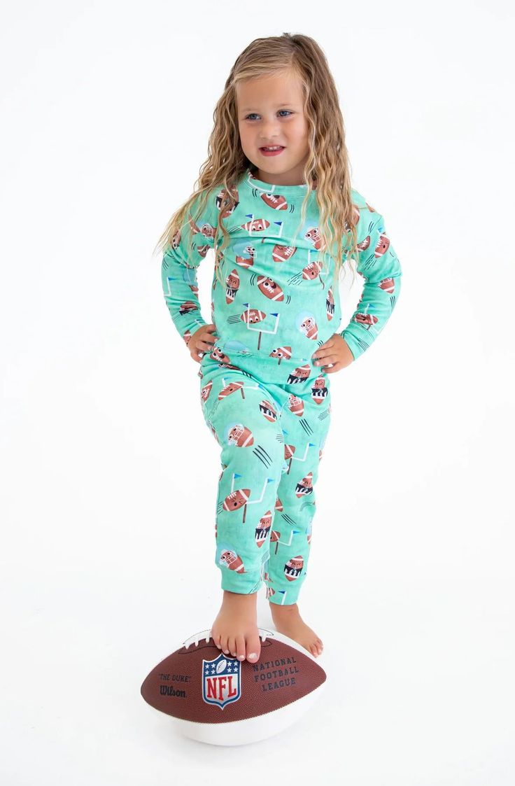 This adorable set is crafted from incredibly soft and breathable viscose from bamboo, cotton, and spandex for an irresistibly comfortable fit! The set features an adorable design perfect for those days spent rooting for your favorite team. [toddler girl outfits jumpsuits and rompers, cute toddler girl outfits, toddler boy outfits, toddler boy rompers, football rompers, football pajamas, jumpsuits and rompers, #rompers #bamboo #toddlerfashion] Shop Birdie Bean Baby today! Cute Cotton Lounging Sets, Casual Tops With Elastic Waistband For Play, Playful Long Sleeve Tops With Matching Set, Playful Long Sleeve Matching Set, Sporty Crew Neck Playwear Set, Cute Matching Loungewear Set, Playful Cotton Bottoms In Matching Set, Stretch Cotton Pajama Party Sets, Playful Long Sleeve Loungewear Set