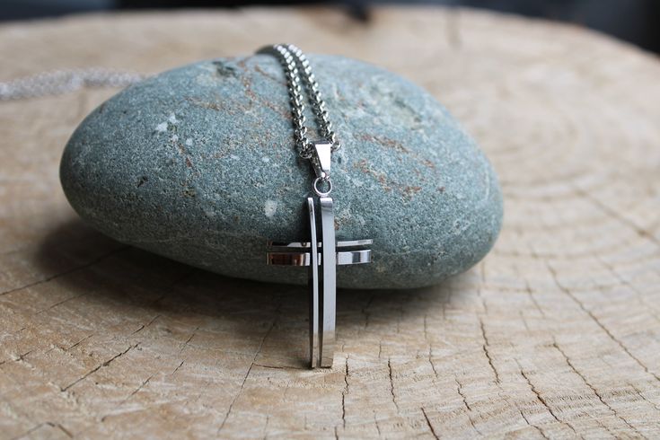 This beautiful cross pendant makes a great gift for yourself or your loved one. D E T A I L S *It features a  high quality stainless steel cross pendant. Pendant measures 36 x 20mm.  Available also in gold. *It hangs from a non tarnish stainless steel chain. *It closes with a large stainless steel lobster clasp. *Length: Choose the length you prefer from the drop down menu. Use the length chart as a reference. On the model you see the 26 inch option. S I Z I N G * H E L P : The smallest necklace Cross Necklace Mens, Stainless Steel Cross Pendant, Mens Cross Necklace, 20 Inch Necklace, Jun 2023, Necklace Mens, Small Necklace, Necklace Cross, Mens Necklace