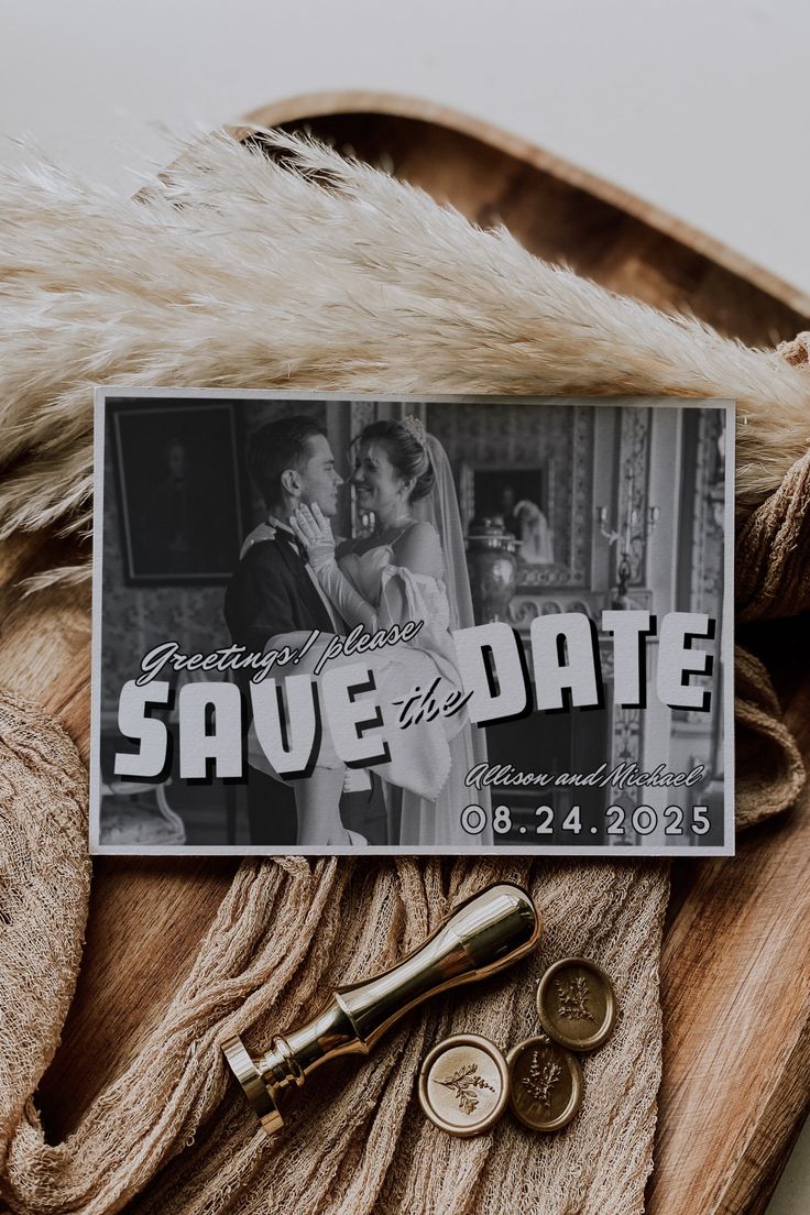 save the date magnets on top of a fur coat