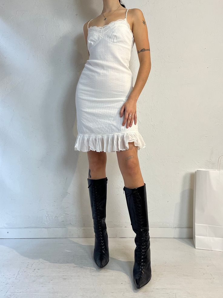 "- BCBG Maxazria white sleeveless mini dress - 100% cotton - Zipper up the side  - Tagged 2 Bust: 16\" Length: 38\"" White Cotton Mini Hem Dress, Fitted Cotton Mini Dress With Ruffles, Cotton Ruffle Mini Dress Fitted, Y2k Style Ruffled Mini Dress For Spring, Y2k Sleeveless Mini Dress With Ruffles, White Fitted Cotton Mini Dress, Fitted White Cotton Mini Dress, Cotton Ruffles Mini Dress, Fitted Cotton Knee-length Mini Dress