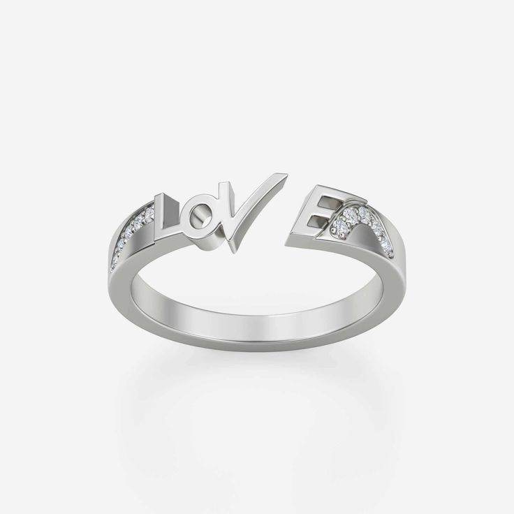 Created to be worn with other beauties or on its own, it will serve you remarkably anyway. This adorable ring with the engraved word LOVE is absolutely optimizing. This amiable ring is made to incite the hidden love inside you. Appreciate yourself and Love yourself with this bewitching ring. Adorned with 10 sparkly gemstones expertly, the total carat weight of this ring is 0.08. The flawless stone color is VS+, and the stone clarity is FG+. The alluring metal types of this band ring are 14K gold and 18K gold infused with high quality. The item weight of 14K gold is 3,265 G, and the item weight of 18 K gold is 3,865 G is perfectly bright. The total item length is 1 MM, and the item width is 2 MM. Silver Initial Ring With Vvs Clarity For Anniversary, Silver Vvs Clarity Initial Ring For Anniversary, Vs Clarity Round Cut Initial Ring For Anniversary, Anniversary Initial Ring With Vs Clarity Round Cut, Fine Sterling Silver Initial Ring For Anniversary, Sterling Silver Initial Ring For Anniversary, Sterling Silver Initial Promise Ring, Sterling Silver Initial Ring With Diamond Accents For Anniversary, Fine Jewelry Sterling Silver Initial Ring For Anniversary