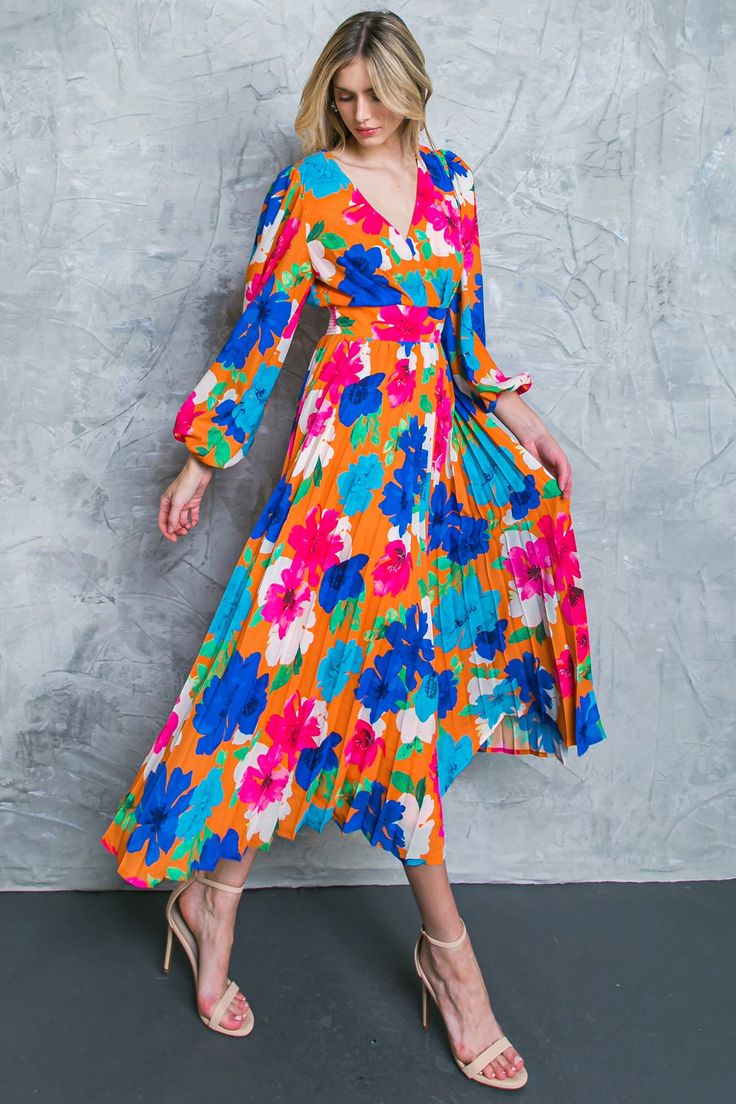 This FIND YOUR FLOWERS WOVEN MIDI DRESS is a stylish choice for almost any occasion. The dress features a V neckline, long sleeve, and pleated skirt, while a smocked back waist band adds comfort and durability. With its bright floral print, this dress adds a fun and colorful touch to your wardrobe. DetailsSelf : 100% PolyesterLining : 100% Polyester Size & Fit- Model is 5`8" And Wearing Size Small- Measurements Taken From Size Small- Approx. Length: 50" Spring Long Sleeve Pleated Dress With Pleated Waist, Long Sleeve Pleated Party Dress, Chic Spring Maxi Dress With Accordion Pleats, Long Sleeve Dresses With Pleated Waist For Brunch, Spring Midi Dress With Pleated Sleeves For Brunch, Spring Long Sleeve Pleated Midi Dress, Flowy Long Sleeve Dress For Spring Brunch, Pleated Long Sleeve Midi Dress For Summer, Long Sleeve Pleated Midi Dress For Summer