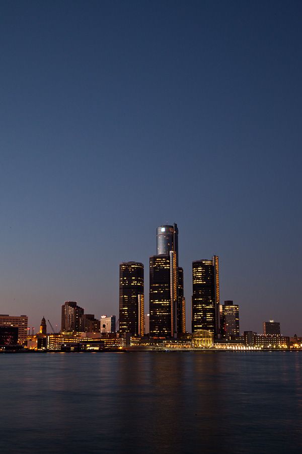 the city skyline is lit up at night