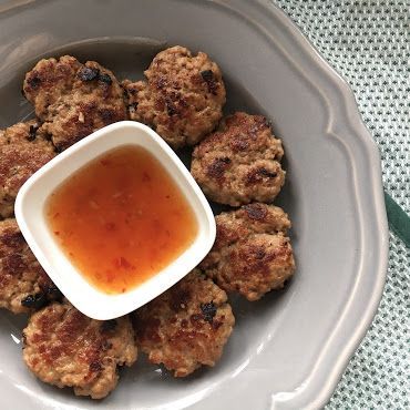 a plate with meatballs and sauce on it