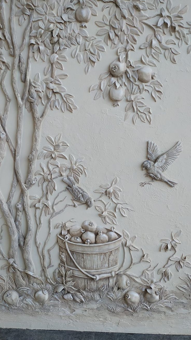 this is a wall mural with birds and fruit in the basket on it's side