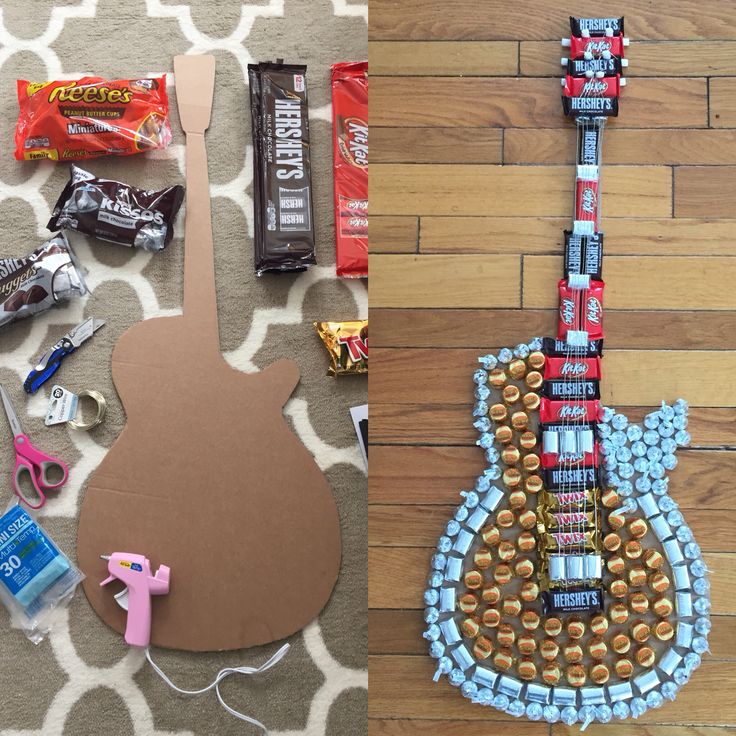 a guitar made out of candy bar wrappers and some other items on the floor