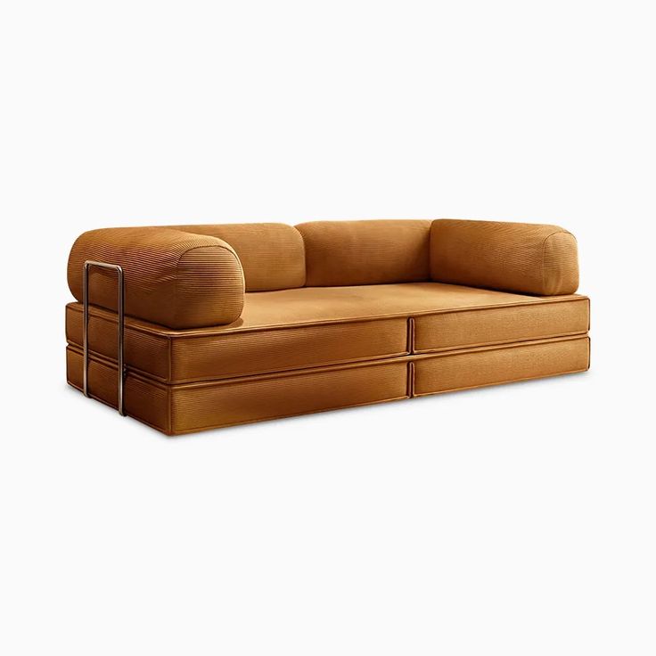 a brown couch sitting on top of a white floor