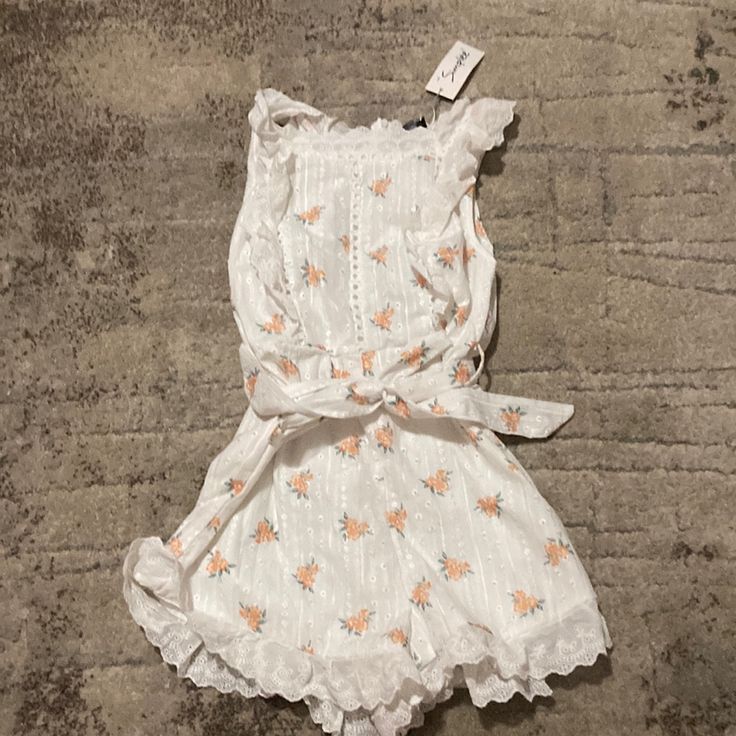 Simple’s Large Women’s White And Orange Flower Dress White Sleeveless Floral Dress With Ruffles, White Feminine Floral Print Dress, White Floral Print Feminine Dress, White Feminine Floral Dress, Cute White Floral Dress For Garden Party, White Floral Embroidered Dress For Garden Party, White Spring Brunch Dress, Chic White Cotton Floral Dress, White Cotton Sundress With Floral Design