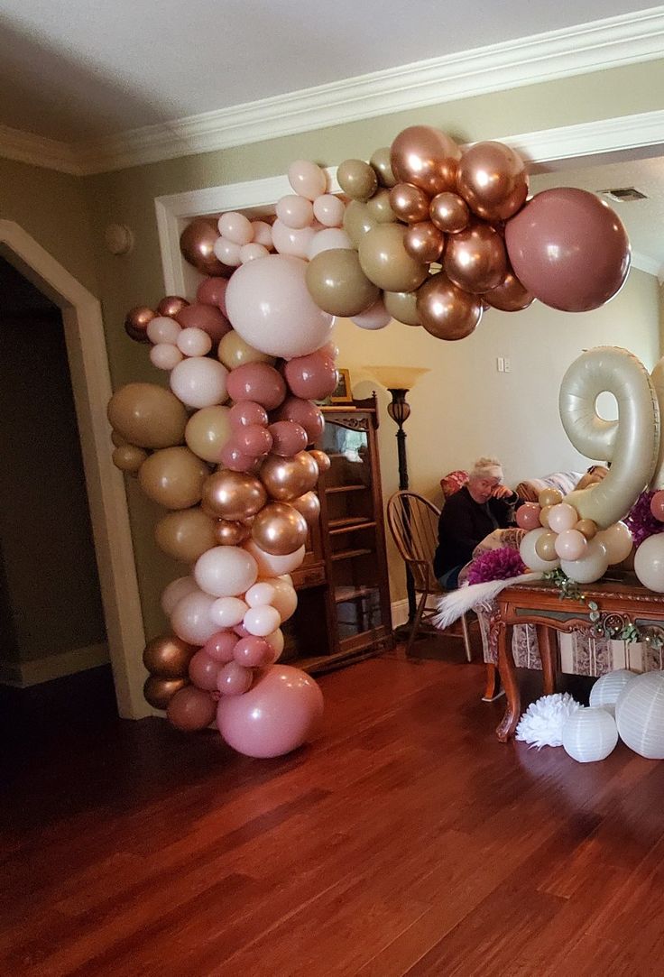 a room filled with balloons and other decorations