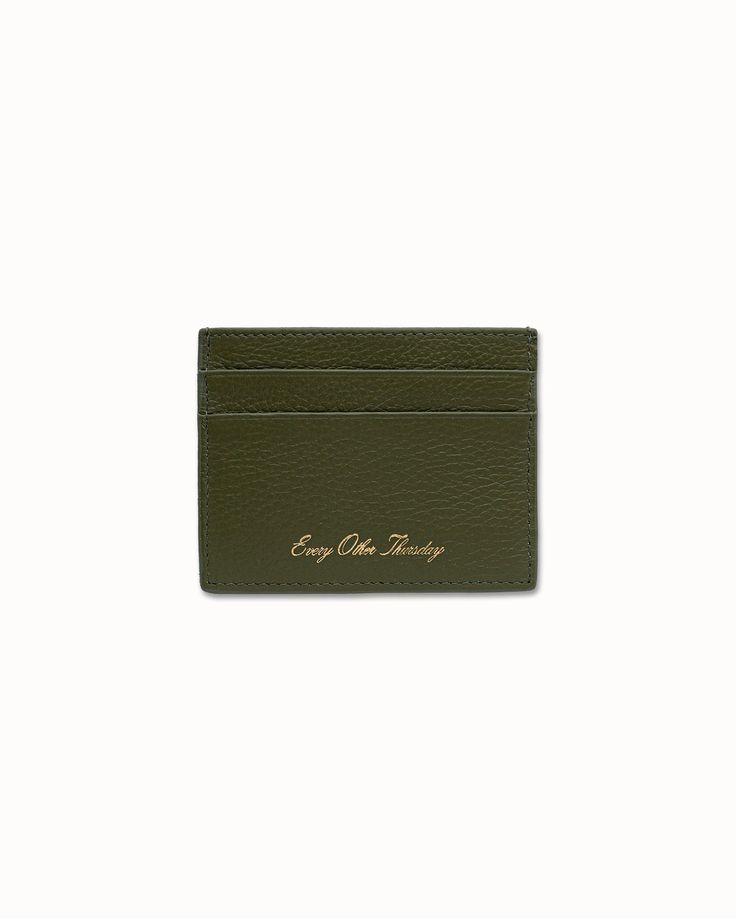 Five slot leather cardholder with gold foil script logo on front. Full grain pebbled leather 2 slots on each side + middle section Gold stamped logo on front