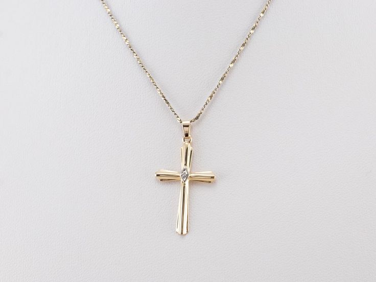 This diamond cross is the perfect everyday piece and would make a great First Communion or Confirmation gift! Crafted of both yellow and white gold, this stately pendant is set with a diamond accent at the center for a look that is special without being ostentatious. This pendant does not come with the chain shown. Please feel free to contact us, we will help you find the perfect chain for your style and budget! Metal: 14K Yellow and White Gold Gem: Diamond Gem Measurements: 0.8 mm, Round Measur Formal Yellow Gold Cross Necklace With Diamond Accents, Formal Yellow Gold Diamond Cross Necklace, Yellow Gold Cross Pendant Necklace With Diamond Accents, Yellow Gold Pendant Cross Necklace With Diamond Accents, Yellow Gold Cross Necklace With Diamond Accents, Yellow Gold Cross Necklace With Brilliant Cut, Yellow Gold Brilliant Cut Cross Necklace, Gold Cross Pendant Necklace With Brilliant Cut, Gold Cross Necklace With Brilliant Cut