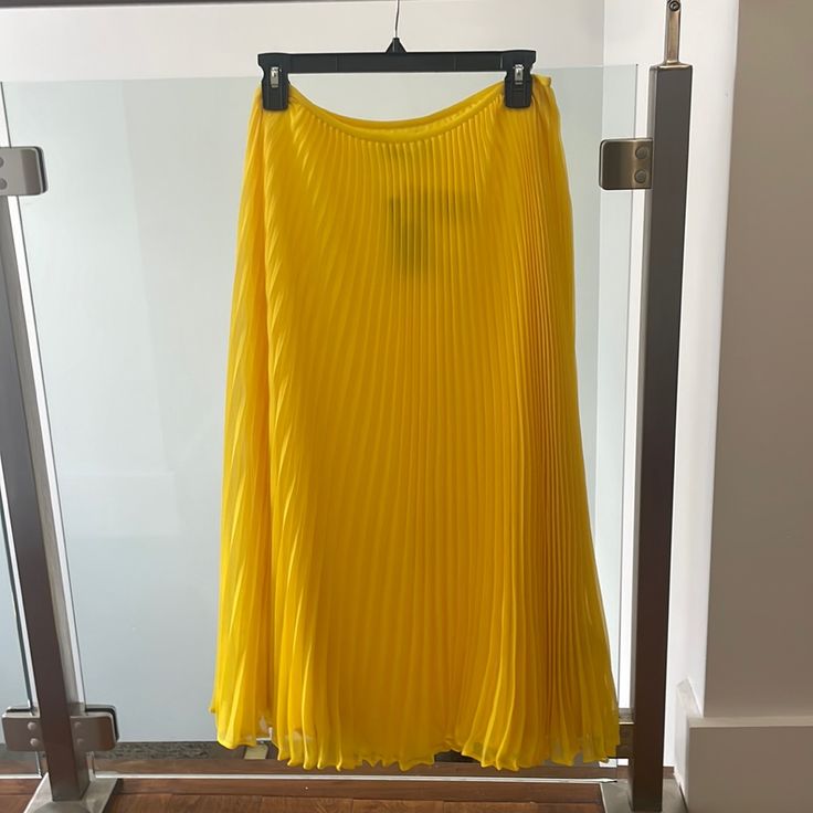 Polo Pleated Midi Skirt Elegant Yellow Pleated Skirt For Summer, Elegant Yellow Pleated Summer Skirt, Elegant Long Yellow Skirt, Elegant Yellow Pleated Bottoms, Elegant Yellow Pleated Skirt, Elegant Yellow Flowy Skirt, Elegant Flowy Yellow Skirt, Yellow Pleated Workwear Skirt, Yellow Pleated Skirt For Work