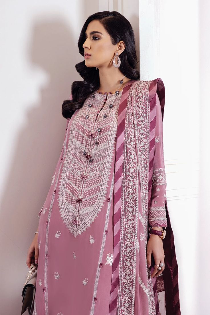 Dusky mauve is enlivened with gorgeous and delicate ivory floral stitchwork in 'Rose Dust.' It is paired with an embroidered diaphanous dupatta with a chatta patti border for a classic semi-formal look. 2 Pieces shirt and dupatta. Elegant Pink Kurta With Floral Embroidery, Elegant Pink Salwar Kameez For Transitional Season, Pink Georgette Lawn Suit With Floral Embroidery, Elegant Purple Dabka Embroidered Fabric, Elegant Purple Fabric With Dabka Embroidery, Traditional Pink Lawn Suit With Intricate Embroidery, Elegant Pink Unstitched Suit With Intricate Embroidery, Elegant Semi-stitched Purple Embroidered Fabric, Elegant Purple Georgette Embroidered Fabric