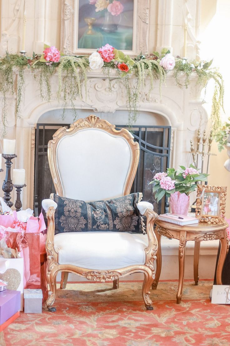 a living room filled with furniture and flowers