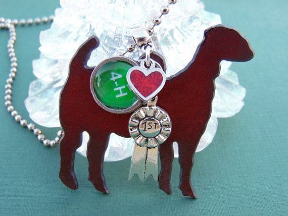 a red dog with a green heart on it's collar