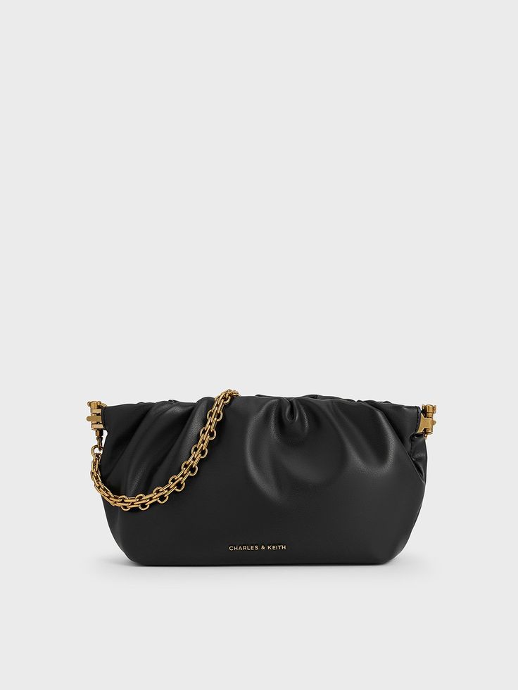 A classic evening bag is a staple in every wardrobe, and the Brigette offers a sophisticated take on that. The elongated silhouette is softened by ruched folds that give it a slouchy appeal. Affixed with a frame closure, you will be able to access your essentials with ease. The versatility of the bag extends beyond its black finish -- it can be carried on the shoulder with the chain strap, slung across the body with the adjustable one, or carried on its own as a clutch. Charles Keith, A Frame, Chain Strap, Evening Bags, Clutch Bag, Wardrobe, Handbags, Chain, Frame