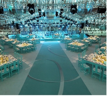 an indoor event venue set up with tables and chairs