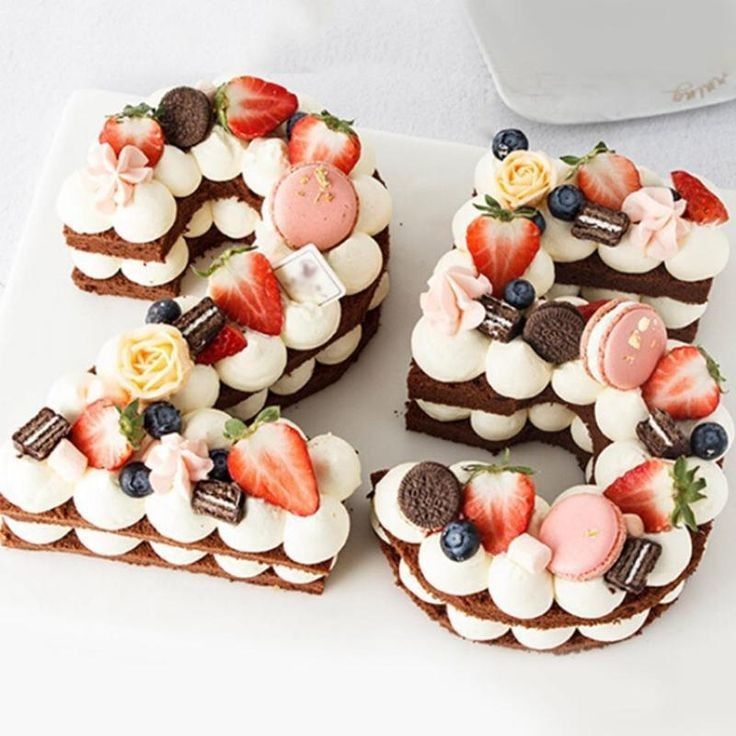 there are six slices of cake with fruit on top, and the number five is made out of chocolate