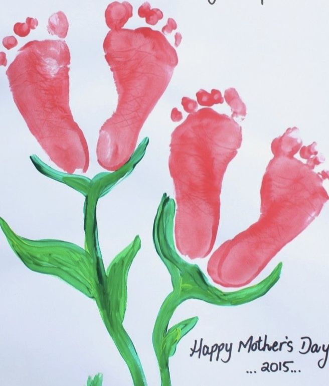 a mother's day card with two feet and flowers