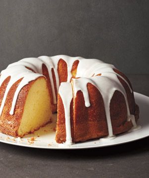 a bundt cake with white icing on a plate