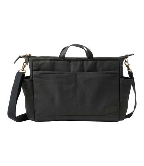 A modern take on a traditional briefcase, this versatile commuter bag carries everything you need for work in one place. Made of rugged cotton canvas with premium leather trim. 100% cotton canvas. Spot clean. Can be carried by hand or over the shoulder. Adjustable, removable shoulder strap. Premium leather handles and trim. Two open pockets on the outside for quick access. Two side pockets for water bottle or umbrella. Fleece-lined padded sleeve holds a laptop up to 15". One large zippered pocke Workwear Canvas Satchel With Adjustable Strap, Travel Cotton Satchel With Top Carry Handle, Functional Canvas Satchel Briefcase, Functional Canvas Briefcase Satchel, Rectangular Workwear Bags With Canvas Lining, Everyday Briefcase With Leather Trim And Coated Canvas, Business Bags With Waxed Canvas And Canvas Lining, Classic Canvas Satchel For Everyday, Classic Everyday Canvas Satchel