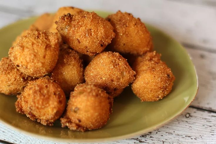 some fried food is on a green plate