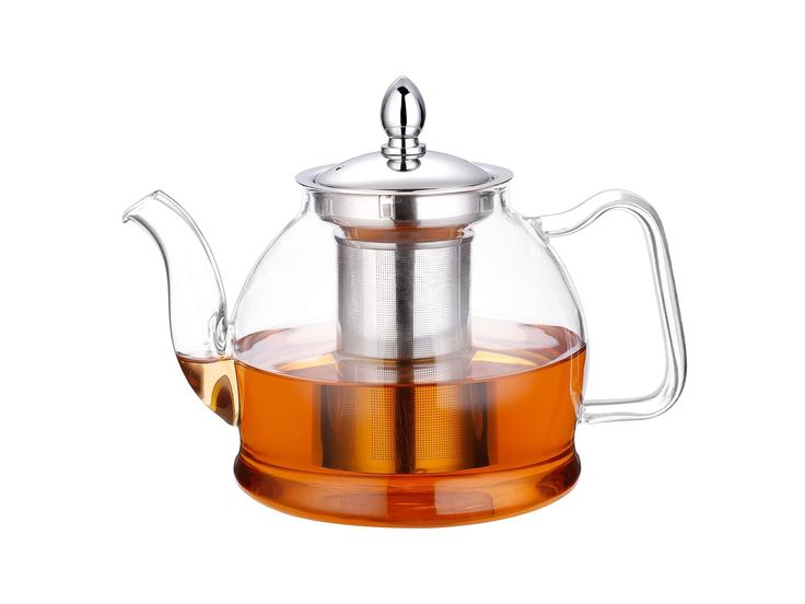 a glass tea pot filled with water and sitting on top of a saucer that is shaped like a teapot