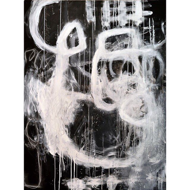 an abstract painting with white paint and black background