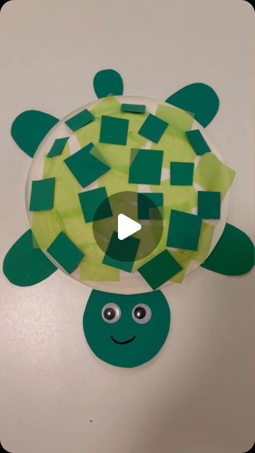 a paper plate with a turtle made out of squares