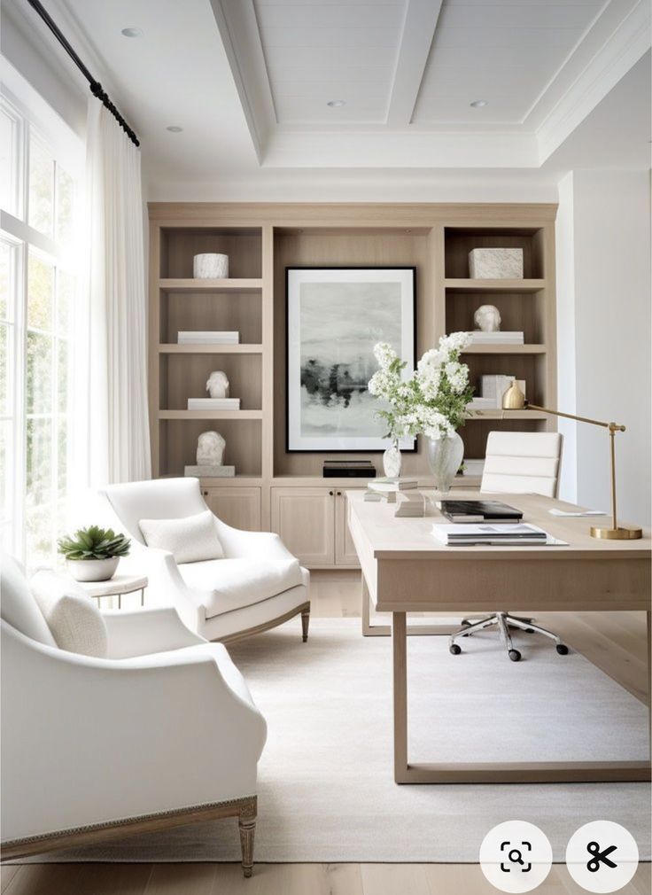 a living room filled with furniture and a white chair next to a desk on top of a hard wood floor