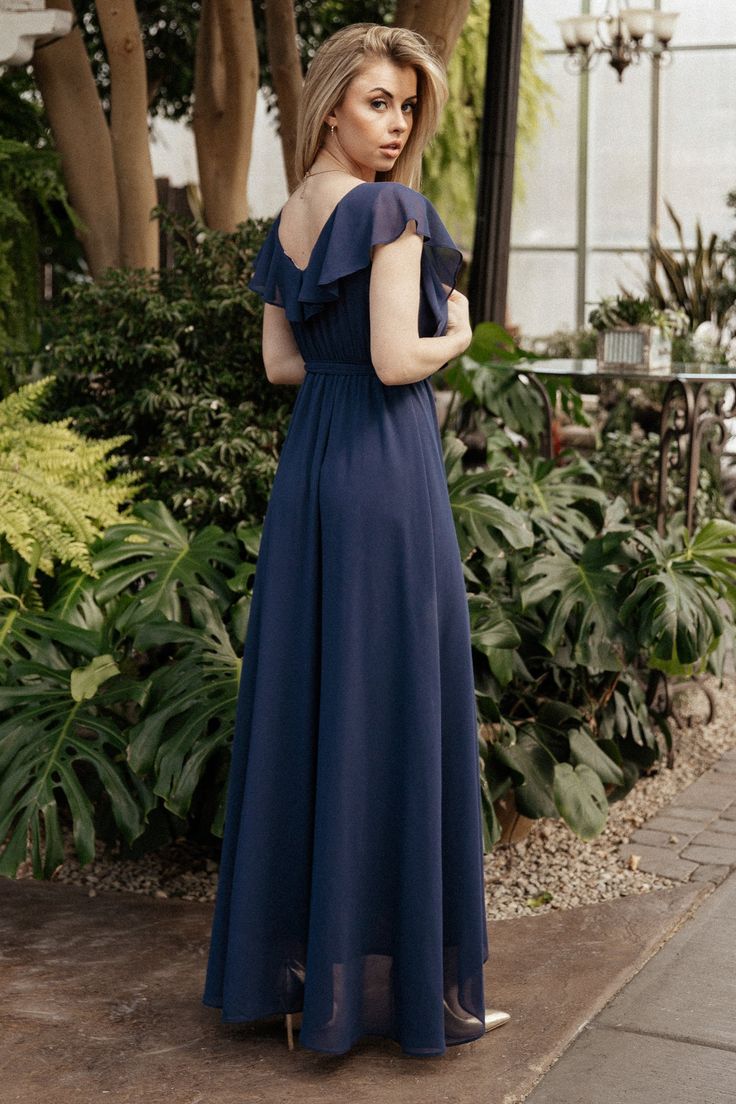 The perfect balance of elegance and simplicity Navy blue color Beautiful chiffon material that flows effortlessly V-neckline and V-back with ruffle overlay Faux wrap surplice bodice Elastic waistband with self-tie sash Tulip style skirt with dramatic movement Lined from tank bodice to mid calf Bump and nursing friendly 100% Polyester Jorgen is 5'5, cup size 32B, and wearing size S Trina is 5'6, cup size 32D, size 2 and wearing size S Dakotah is 6'0", cup size 42C, size 20 and wearing size 3X Ruffle Maxi Dress, Tulip Skirt, Nursing Friendly, Maxi Dress Navy, Chiffon Material, Style Skirt, Ruffled Maxi Dress, Navy Blue Color, Cup Size