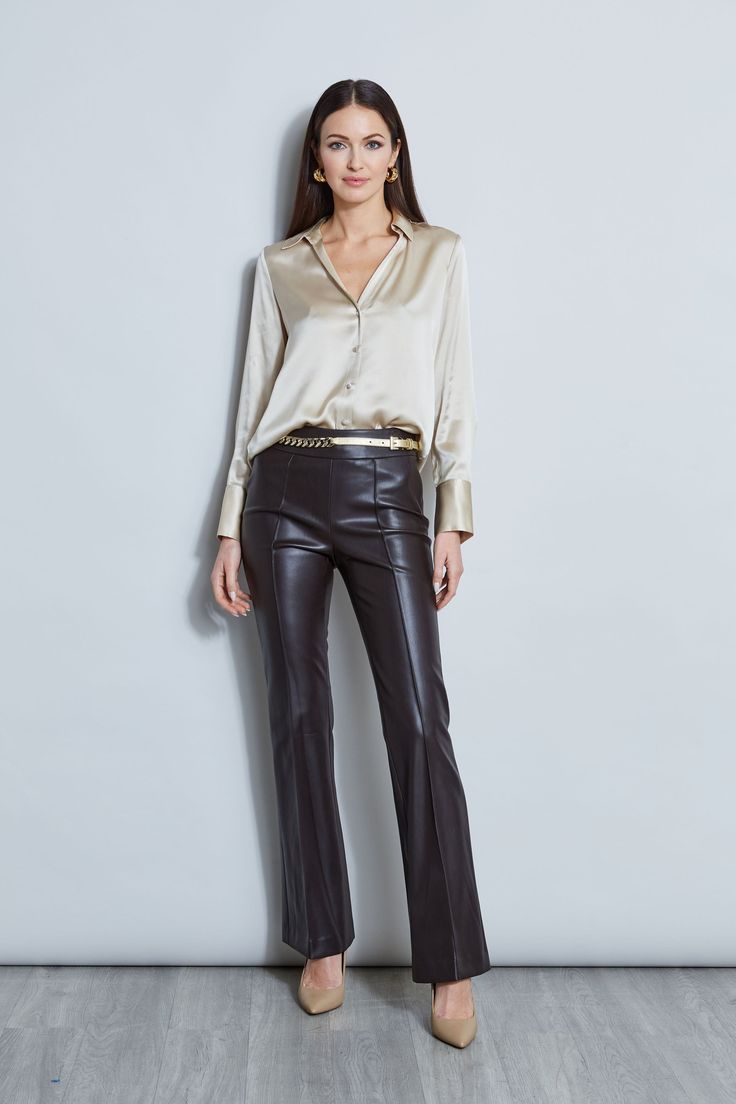 Nothing beats the chic factor and luxe patina of a Silk Satin shirt. Our button-down design features a v-neckline that is perfect for layering under a blazer or wearing on its own- you will live in this shirt all season long. Elie Tahari Exclusive Long Sleeve Silk Satin Button Down shirt 100% Silk Relaxed Fit; Runs true to size. Model is 5'9" and wearing size S Length From Shoulder to Hem: Back 26"L, Sleeve 32.5"L (approx. length for size S) Dry Clean Only Imported Style #: E107G513 Leather Button Up Shirt Outfit, Patent Leather Pants, Satin Button Down Shirt, Leather Blazer Women, Leather Pants Outfit, Leather Pants Women, Satin Shirt, Long Sleeve Short Dress, Elie Tahari