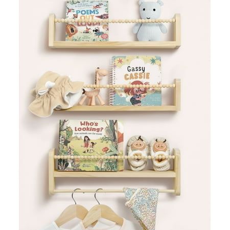 three wooden shelves with books and toys on them