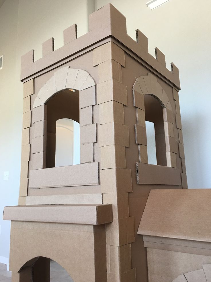 a cardboard castle made to look like it is built into the ground