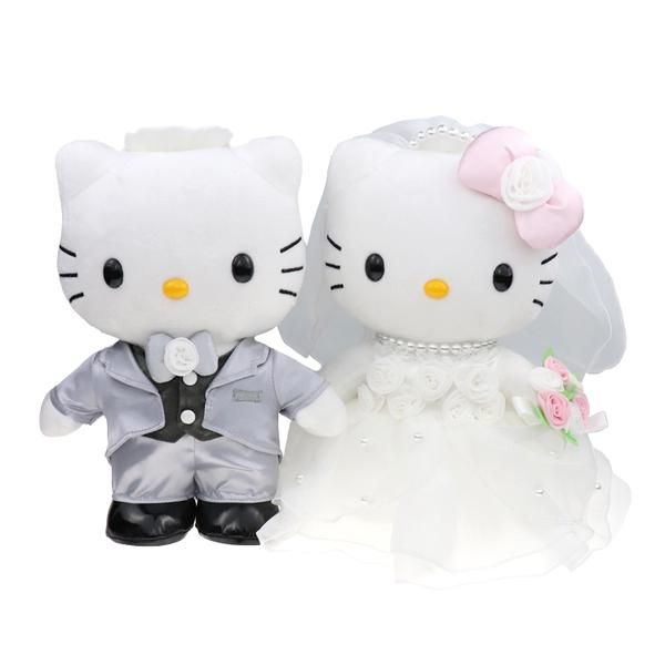 two hello kitty dolls dressed in wedding attire