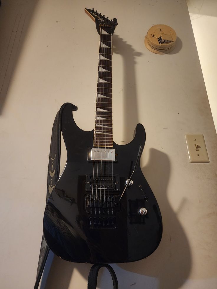 an electric guitar sitting on top of a table