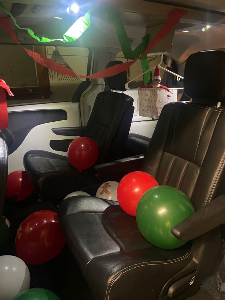 balloons and streamers in the back seat of a vehicle for a birthday or party