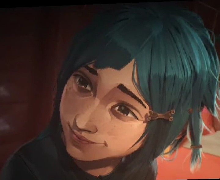 an animated image of a woman with green hair and piercings on her ears, looking at the camera