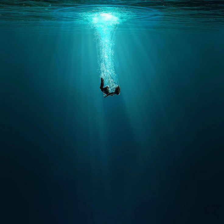 a person is swimming in the ocean with their head above the water's surface