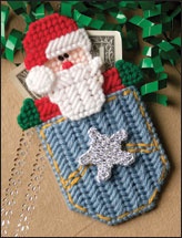 a christmas ornament with a santa clause in a pocket