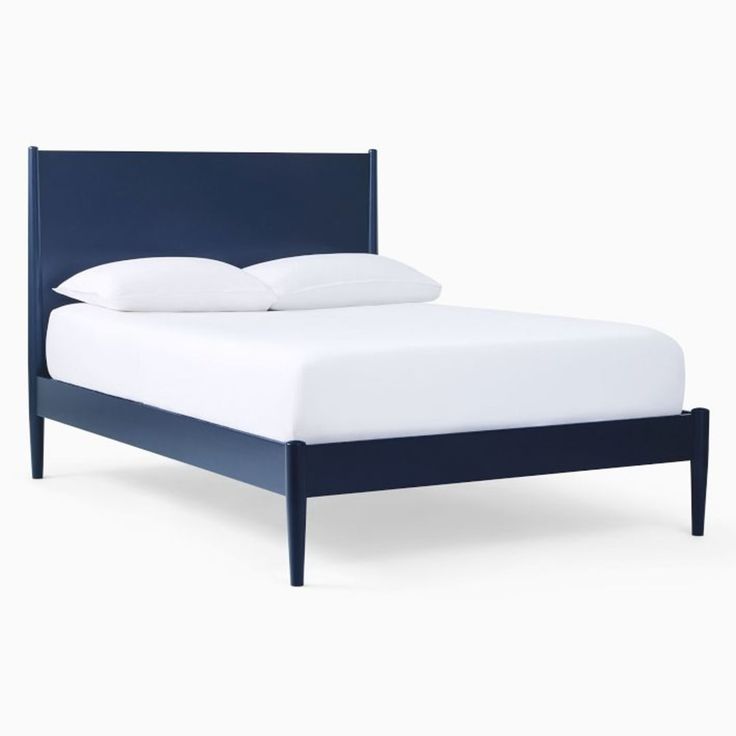 a bed with white sheets and blue headboard is shown in front of a white background