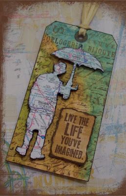 a tag with an image of a man holding an umbrella and the words live the life you've maine