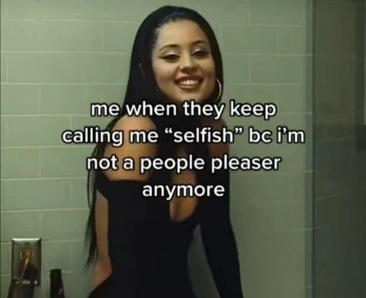 a woman standing in front of a bathroom mirror with the caption me when they keep calling me selfish bc i'm not a people pleaser anymore anymore