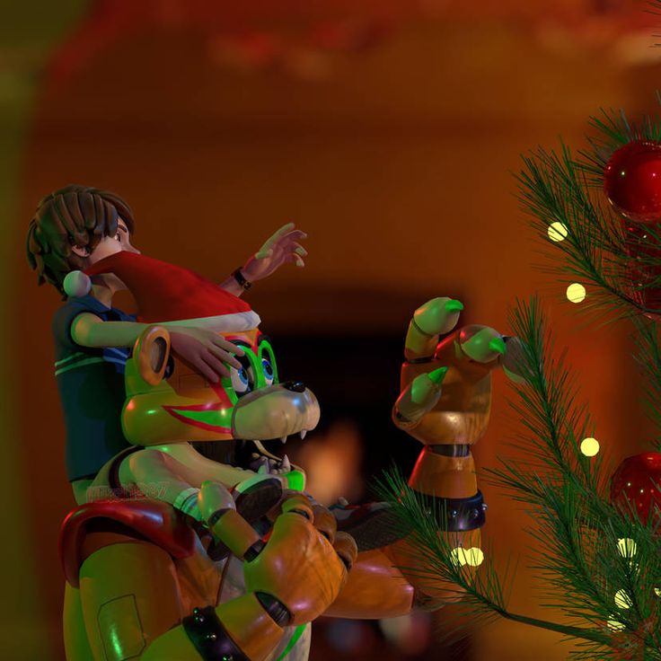 a couple of figurines sitting next to a christmas tree with lights on it