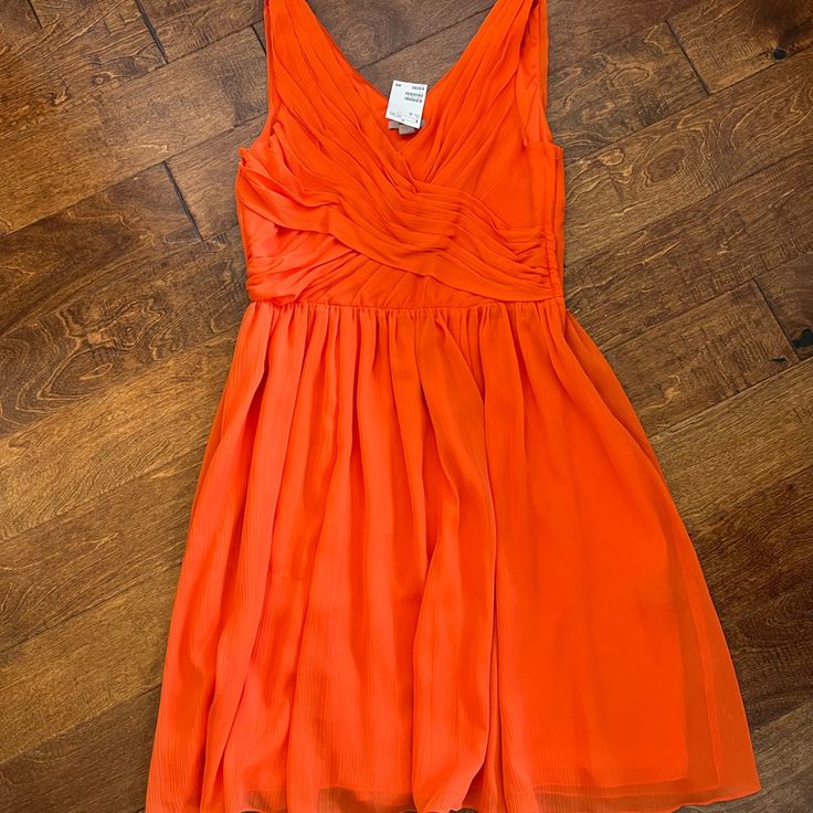 Nwt Dress. Beautiful Orange Color. Flowy Design. Fully Lined. H&M Size 14 Dress. Zip Closure In The Back. Ribbed On The Sides. Fitted Up Top Then Is Flowy. Knee/Tea Length. Smoke And Pet Free Home. H&m V-neck Dress For Formal Occasions, H&m V-neck Formal Dress, H&m Formal V-neck Dress, H&m Flowy V-neck Dress, H&m Mini Dress For Summer Cocktail, H&m Summer Formal Dresses, H&m Formal Dresses For Summer, H&m Summer Cocktail Mini Dress, H&m Sleeveless Cocktail Dress