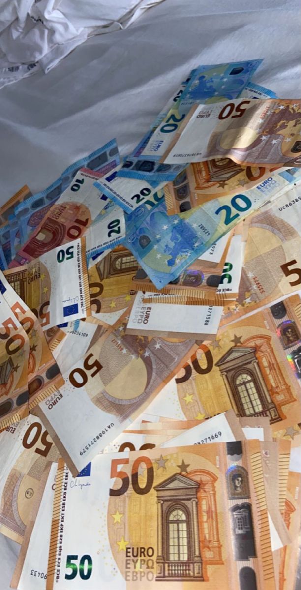 a pile of 50 euro bills laying on top of each other