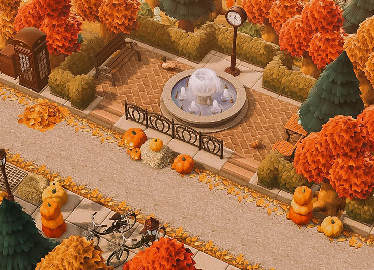 an aerial view of a park with pumpkins and trees