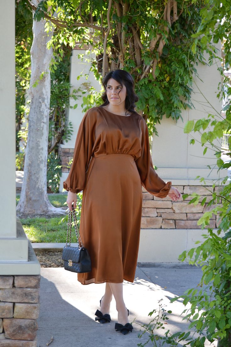 From one of our favorite brands... I'm not sure what I love most! Definitely something that would work for the holidays. Alyce features a loose fit beautiful bodice, lining, elastic waist and long loose sleeve. The style is definitely one for all body types. Modeled in medium 5'7". 100% Polyester - Outer 97% polyester/3% Spandex XSmall (bust 36"/waist 26-34"/length 48") Small (bust 38”/waist 28-36”/length 49”) Medium (bust 40”/waist 30-38”/length 50") Large (bust 42'/waist 32-40"/length 50") XLa Fall Dresses With Blouson Bishop Sleeves, Fall Workwear Dresses With Blouson Sleeves, Fall Midi Dress With Blouson Bishop Sleeves, Chic Long Sleeve Midi Dress With Gathered Waist, Chic Relaxed Fit Dress With Elastic Waistband, Fall Midi Dress With Elastic Sleeves For Date Night, Elegant Fall Dresses With Elastic Waistband, Elegant Fall Midi Dress With Gathered Waist, Fall Lantern Sleeve Midi Dress For Date Night