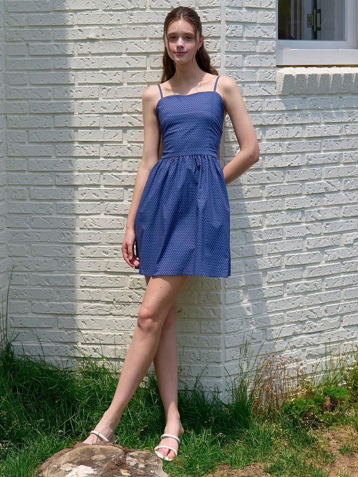 This is a trendy and feminine dress by JOORTI that is made out of high quality and sturdy material. With distinctive mood of the design and comfortable wear, you can style it for your casual daily outfit.- Adjustable buckle on the shoulder strap- Smocking on the back with comfortable wear - Feminine and casual mood Casual Dresses With Tie Straps For Daywear, Casual Dress With Tie Straps For Daywear, Casual Fitted Sundress With Tie Straps, Casual Knee-length Sundress With Tie Straps, Casual Midi Dress With Smocked Bodice And Straight Neckline, Casual Cotton Mini Dress With Adjustable Straps, Casual Sundress With Tie Straps For Day Out, Casual Spaghetti Strap Dress For Daytime, Casual Fitted Midi Dress With Tie Straps